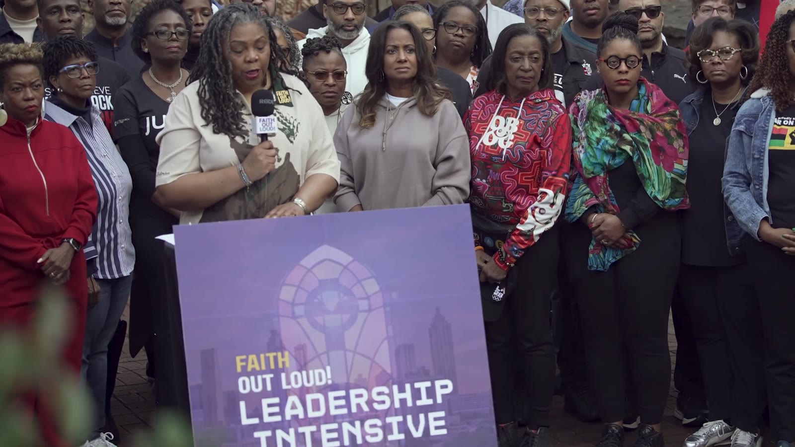 Rev. Traci Blackmon speaking to a gathered crowd at a Faith Out Loud! Leadership Intensive