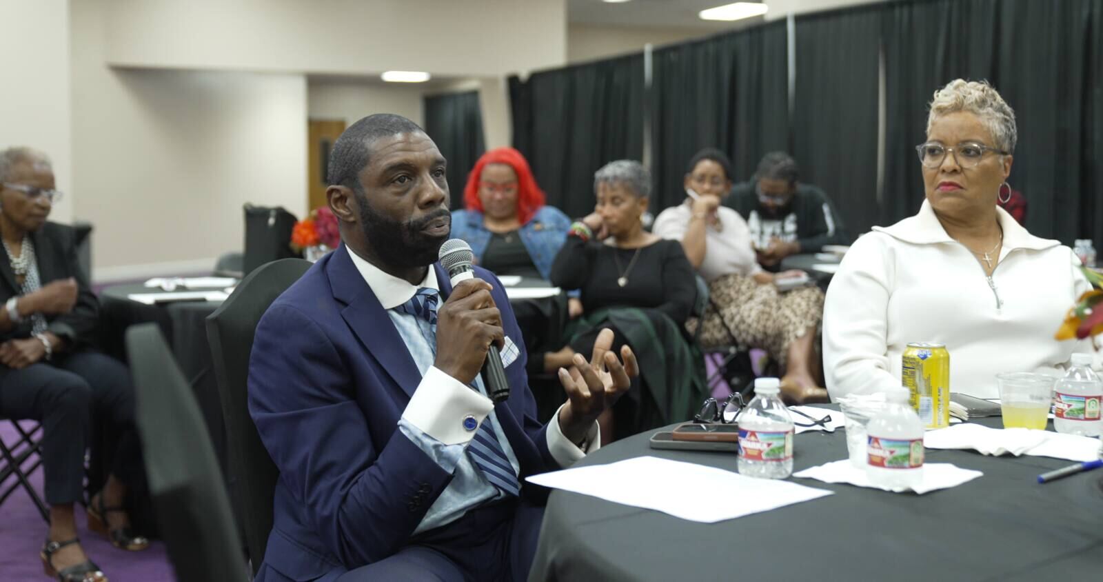 A speaker addressing a Faith Out Loud! gathering
